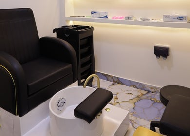 Pedicure station at NU Gent's Salon in Dubai, Dubai, AE featuring premium seating and amenities.