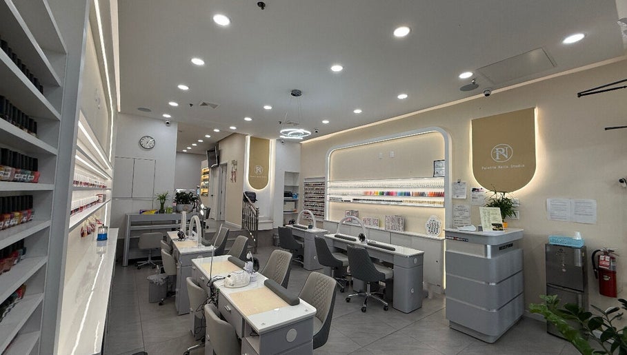 Elegant interior of newpalettenailsstudio in New York, New York, US showcasing modern manicure stations.