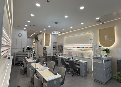 Elegant interior of newpalettenailsstudio in New York, New York, US showcasing modern manicure stations.