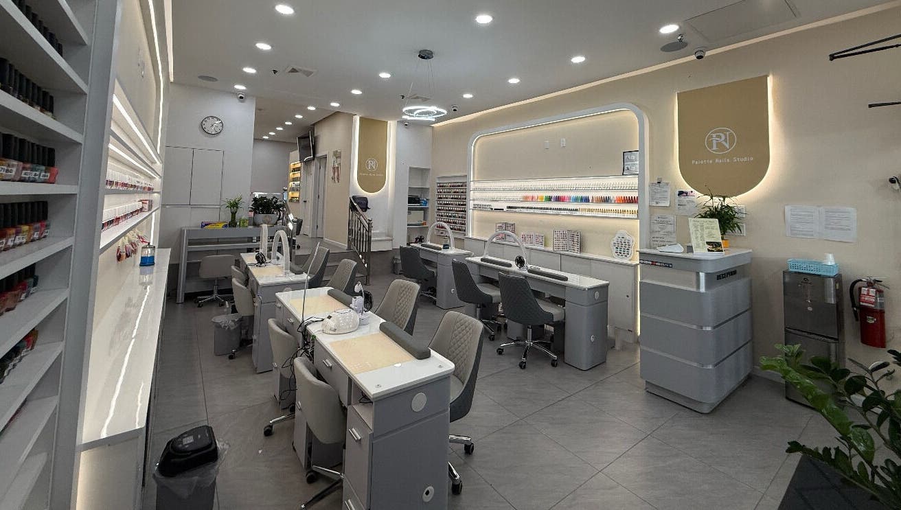 Modern interior of newpalettenailsstudio in New York, New York, US with chic nail stations and polished decor.