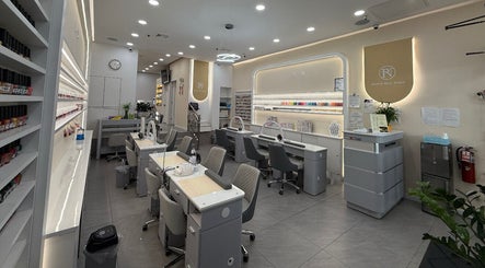 Modern interior of newpalettenailsstudio in New York, New York, US with chic nail stations and polished decor.