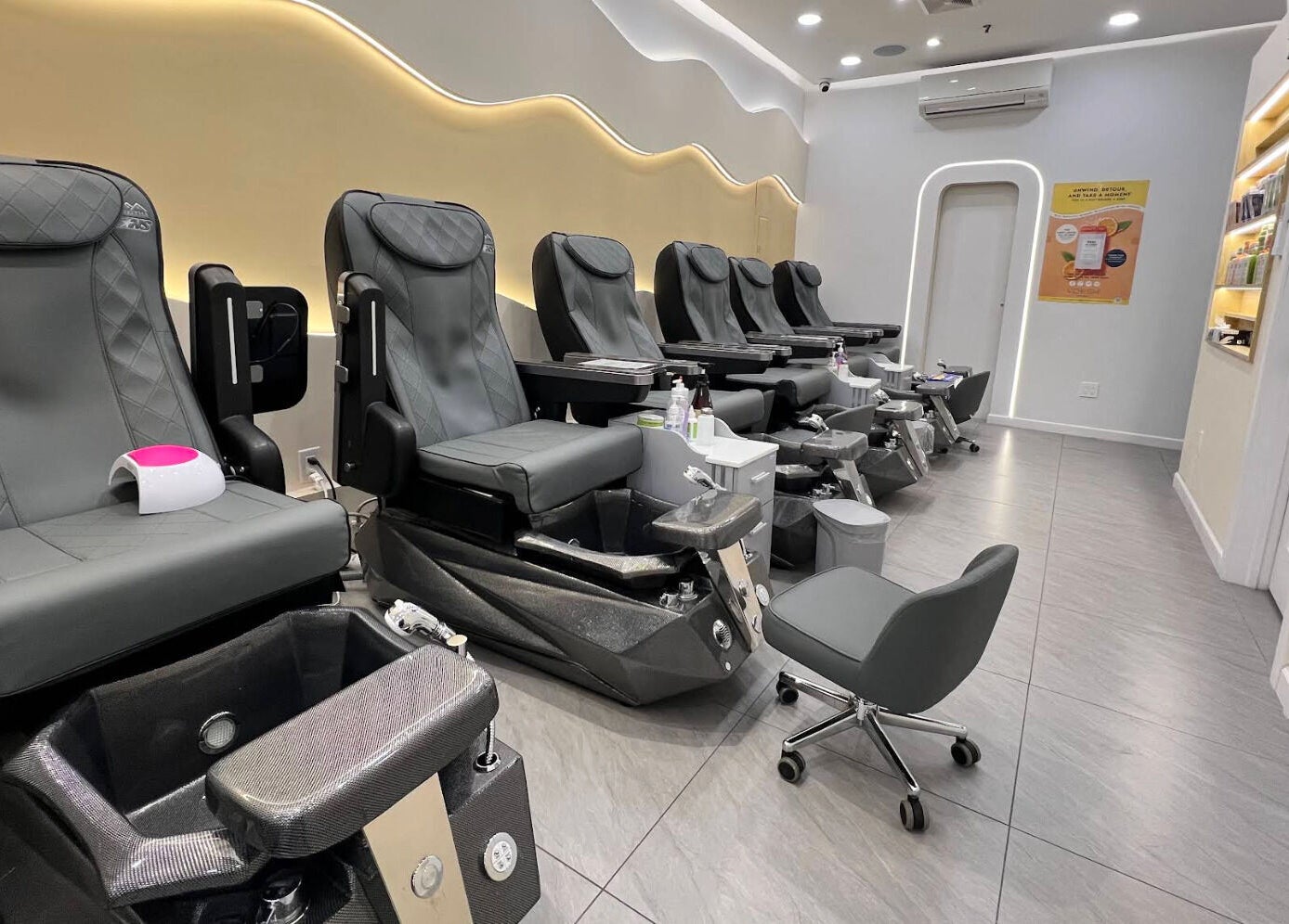 Modern pedicure chairs at newpalettenailsstudio, New York, New York, US, showcasing luxury and comfort.