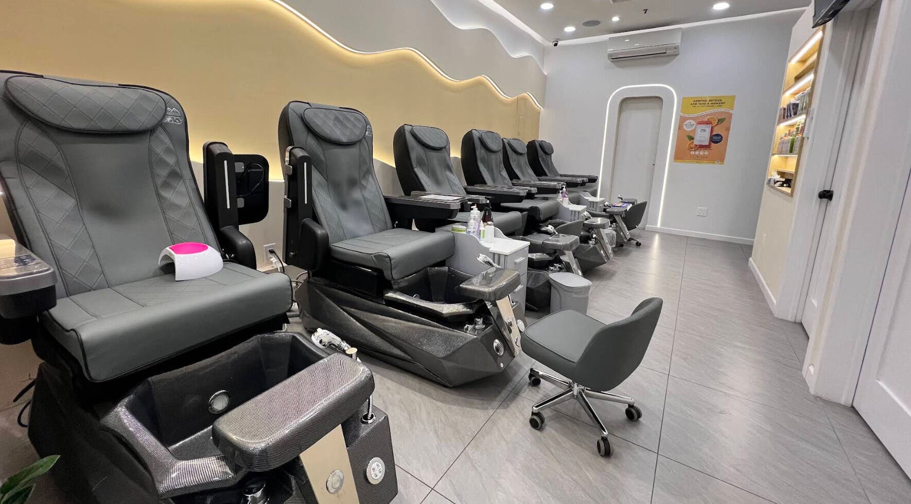 Modern pedicure chairs at newpalettenailsstudio, New York, New York, US, showcasing luxury and comfort.
