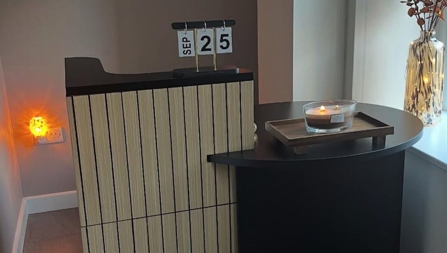 Inviting reception at SKNCO, East Kilbride, Scotland with candlelit ambiance and stylish decor.