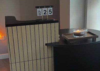 Inviting reception at SKNCO, East Kilbride, Scotland with candlelit ambiance and stylish decor.