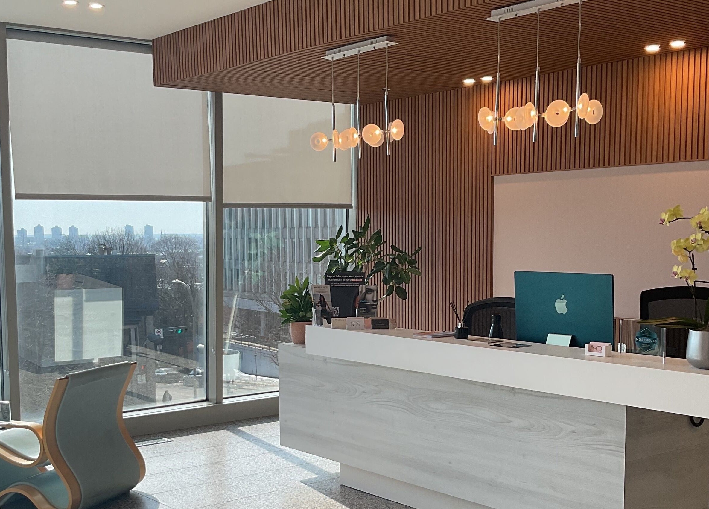 Reception area at Aesthetic Injector Randa, Westmount, Quebec, CA with modern decor and scenic view.