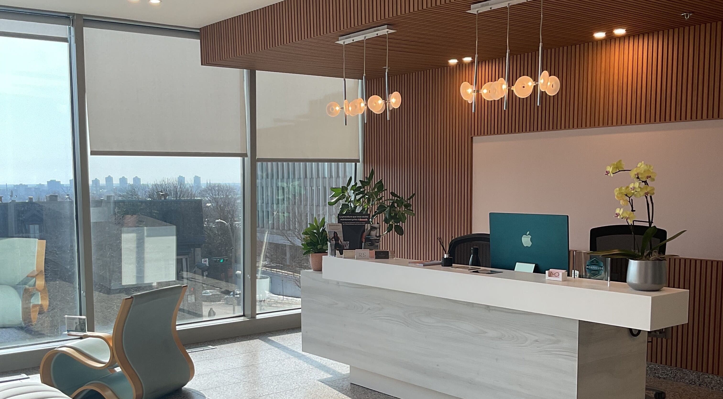 Reception area at Aesthetic Injector Randa, Westmount, Quebec, CA with modern decor and scenic view.