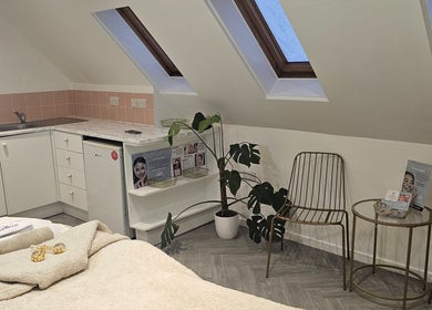Cozy room with decor and skincare items at AuraLuxe Aesthetics, Saint Leonards, England, GB.