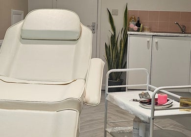 Elegant treatment room at AuraLuxe Aesthetics, Saint Leonards, England, GB, featuring modern decor and equipment.