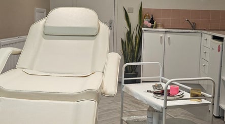 Elegant treatment room at AuraLuxe Aesthetics, Saint Leonards, England, GB, featuring modern decor and equipment.