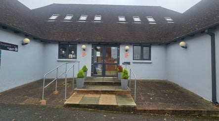 Front entrance of AuraLuxe Aesthetics in Saint Leonards, England, GB, featuring modern design.