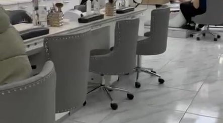 Modern nail station at Medispa Naturhouse, Stevenage, England, GB with stylish gray chairs.