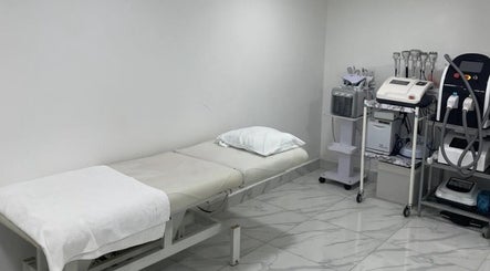Modern treatment room at Medispa Naturhouse, Stevenage, England, GB, showcasing professional wellness equipment.