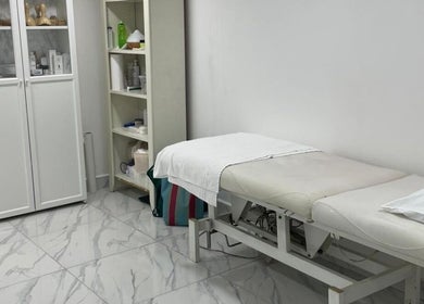 Relaxing treatment room at Medispa Naturhouse in Stevenage, England, GB, featuring a comfortable treatment bed.