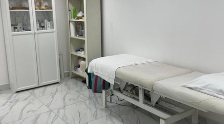 Relaxing treatment room at Medispa Naturhouse in Stevenage, England, GB, featuring a comfortable treatment bed.