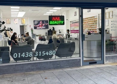 Front view of Medispa Naturhouse nail salon in Stevenage, England, features vibrant signage and welcoming interior.