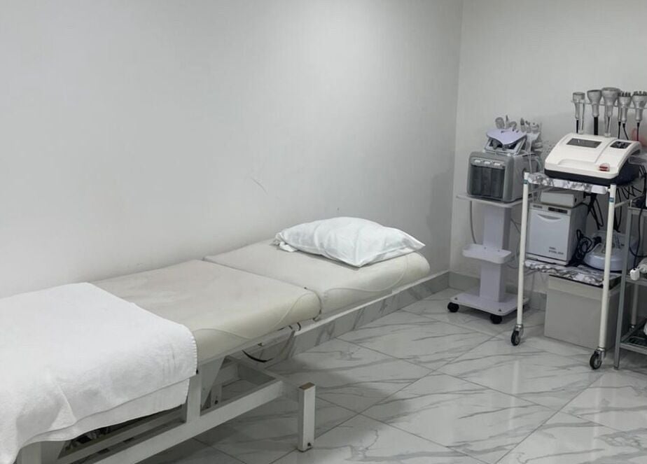 Treatment room at Medispa Naturhouse, Stevenage, England, featuring modern equipment and relaxing ambiance.