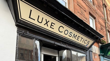 Front view of Luxe Cosmetics, featuring elegant sign, near Nails by Sara, Port Glasgow, Scotland, GB.