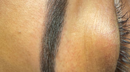 Close-up of expertly shaped eyebrow at Farnaz Beauty, London, England, GB.