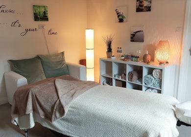 Tranquil massage room at Harmony Wellbeing, Croydon, England, GB, offering relaxation and wellness services.