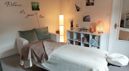 Tranquil massage room at Harmony Wellbeing, Croydon, England, GB, offering relaxation and wellness services.