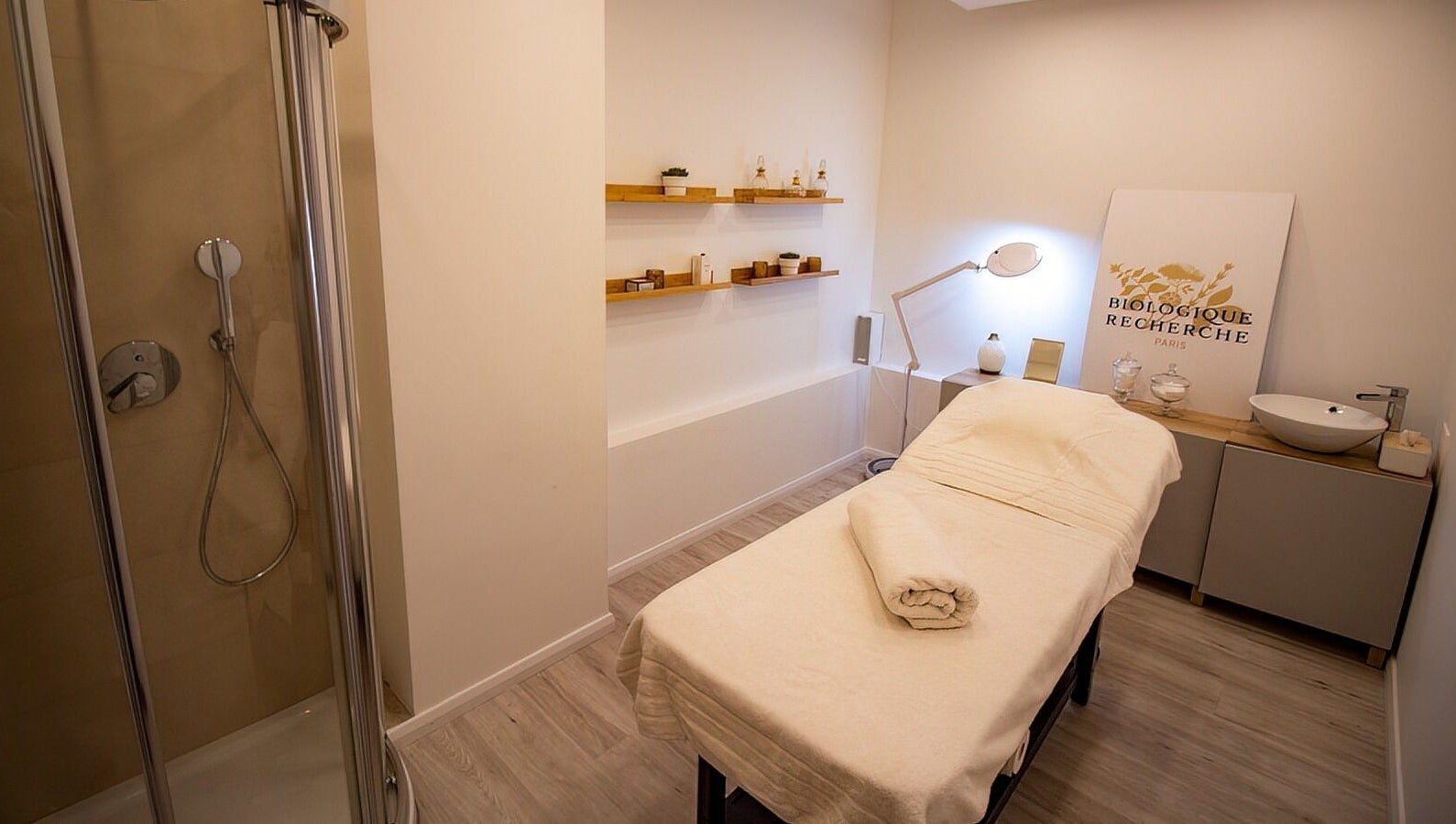 Relaxing treatment room at Studio 44 Clinic in Gibraltar, GI, featuring a massage bed and modern decor.