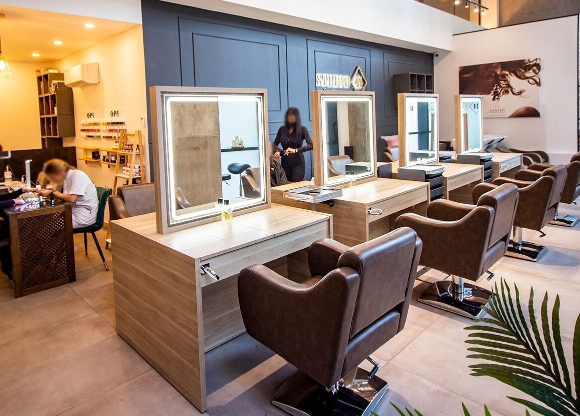 Modern interior at Studio 44 Clinic, Gibraltar, GI with elegant salon chairs and bright mirrors.