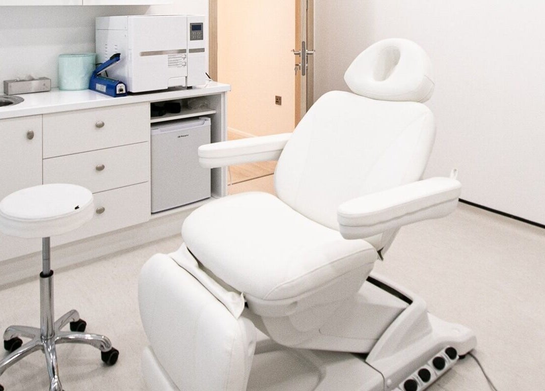 Modern treatment room at Studio 44 Clinic in Gibraltar, GI featuring a luxurious reclining chair.