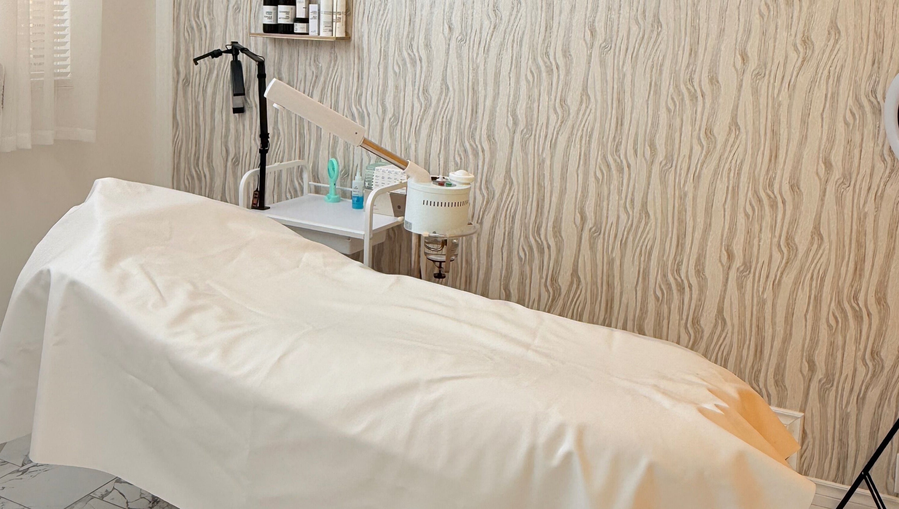 Relaxing treatment room at Soul Heaven Spa in Shelburne, Ontario, CA with a massage bed and soothing decor.