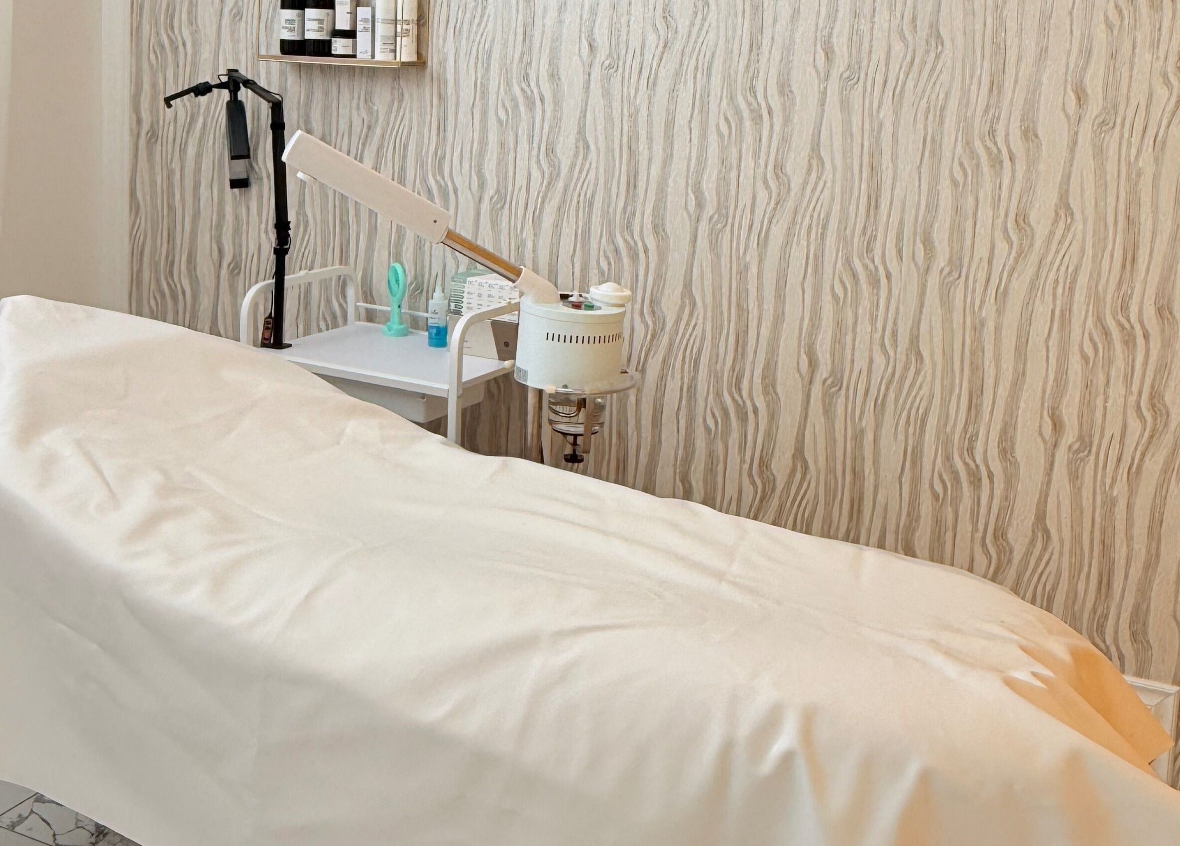 Relaxing treatment room at Soul Heaven Spa in Shelburne, Ontario, CA with a massage bed and soothing decor.
