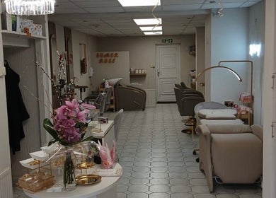 Elegant interior of Hair by Jess Marie, Great Sankey, England, GB, showcasing stylish chairs and decor.