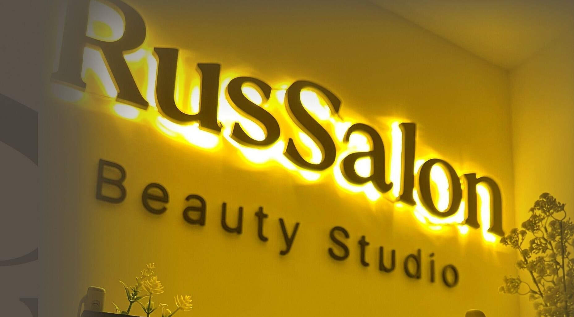 Neon sign of Russalon Beauty Studio in Marrakech-safi, Marrakech-safi, MA glowing warmly.