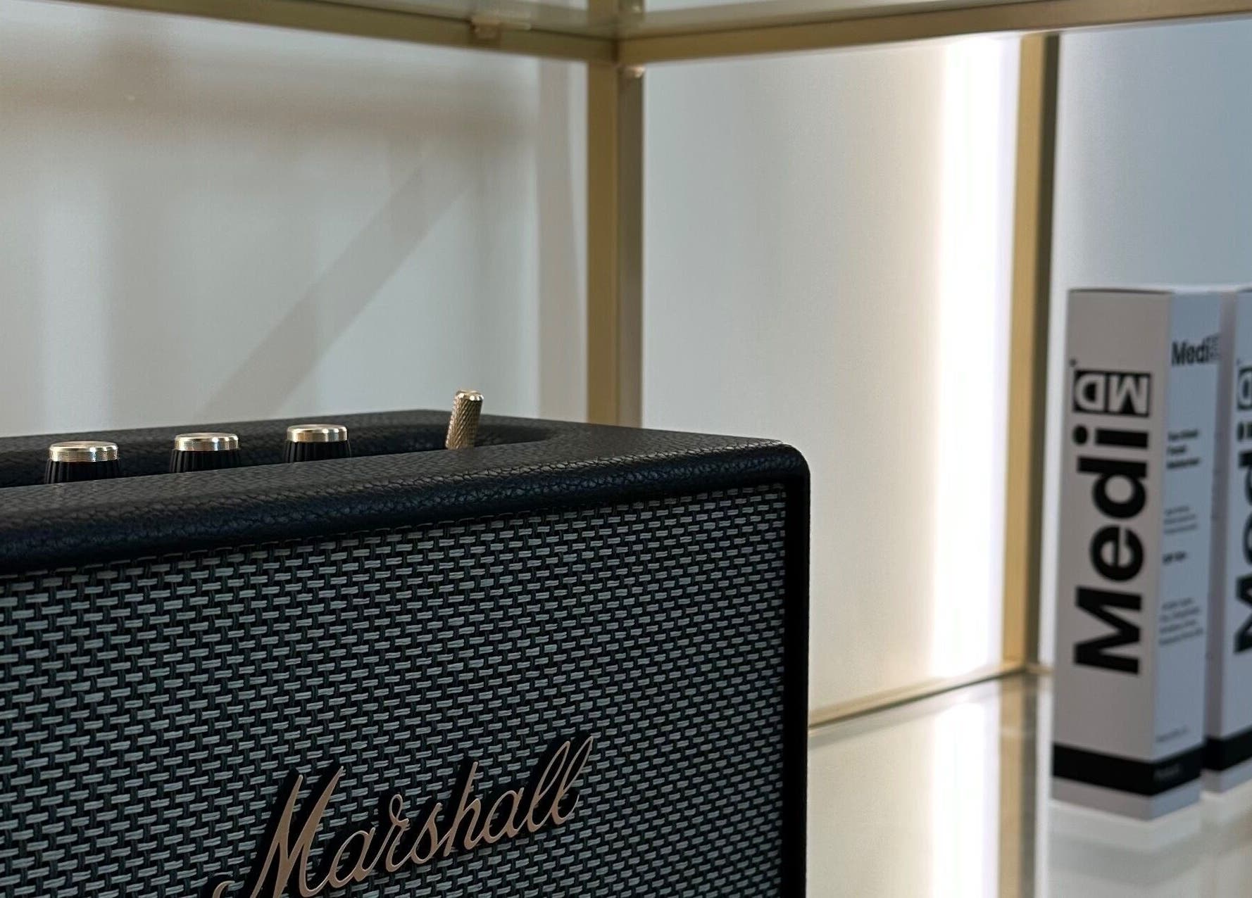 Stylish speaker at Melatone Skin Clinic, London, England, GB, enhancing the modern vibe.