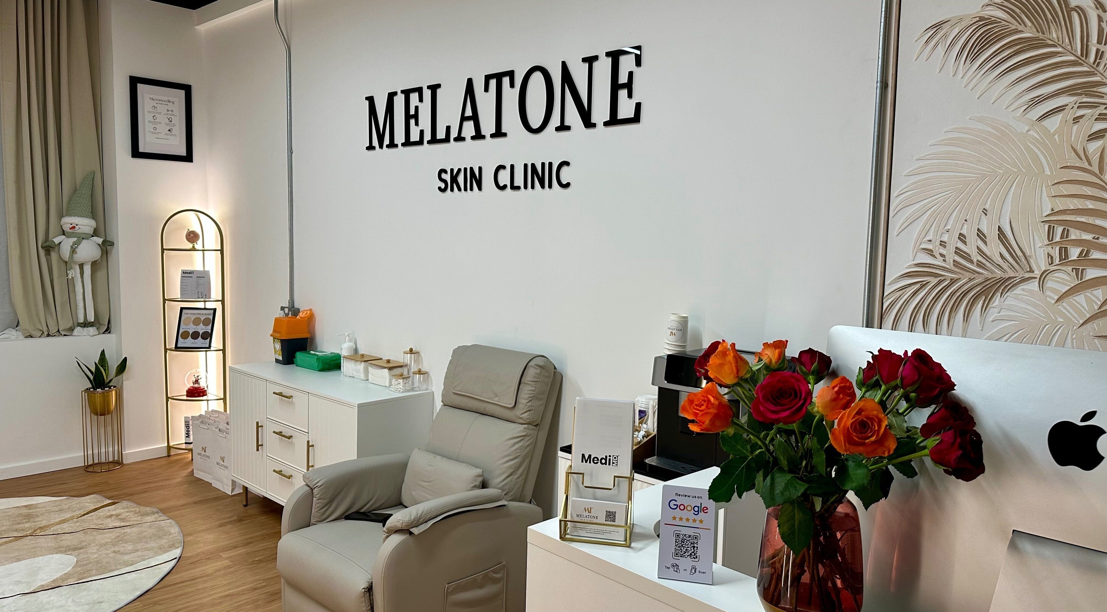 Elegant interior of Melatone Skin Clinic in London, England, GB, featuring a comfortable chair and vibrant decor.