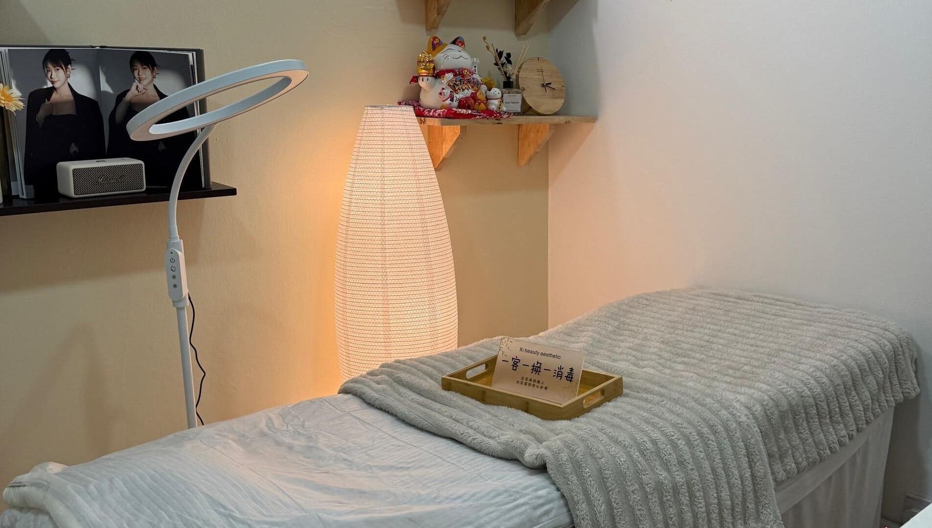 Cozy treatment room at Xi Beauty Aesthetic, Puchong, Selangor, MY with ambient lighting and soft decor.
