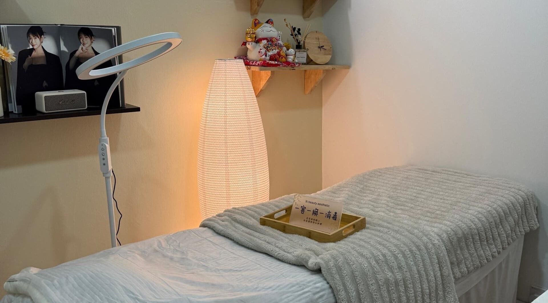 Cozy treatment room at Xi Beauty Aesthetic, Puchong, Selangor, MY with ambient lighting and soft decor.