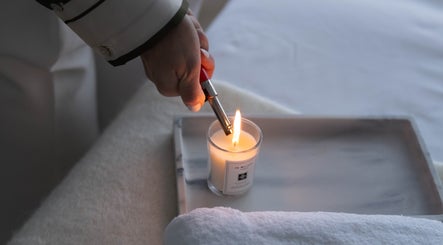 Cozy candle lighting at Contourista London, enhancing relaxation. Located in London, England, GB.