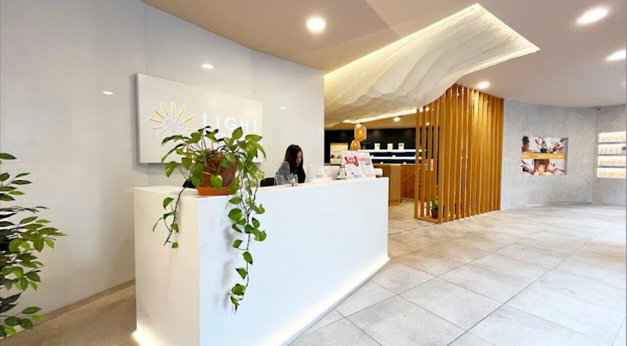 Reception area of Contourista London, London, England, GB featuring elegant decor and potted plants.