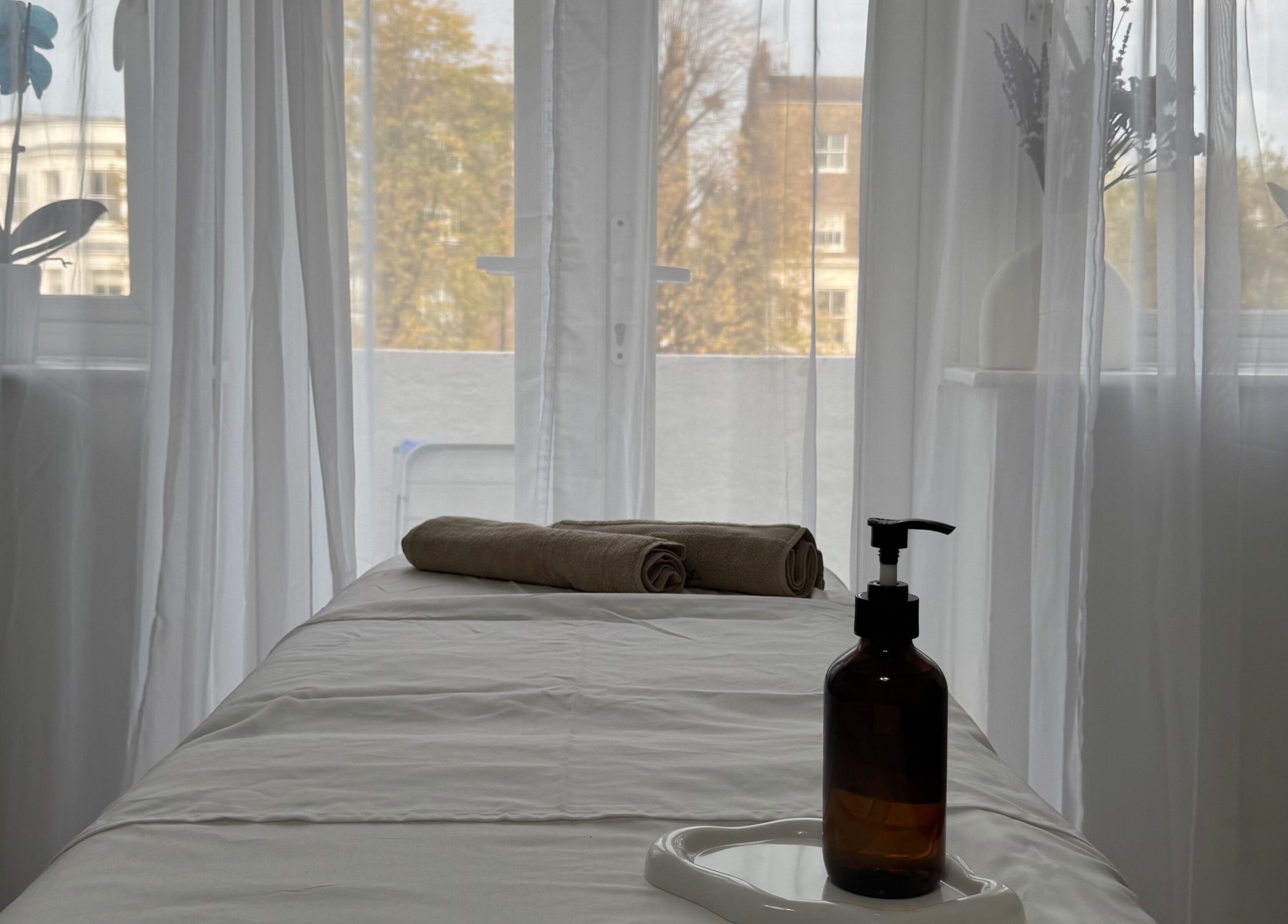 Massage table in tranquil spa setting at Contourista London - Mobile Services, London, England, GB.