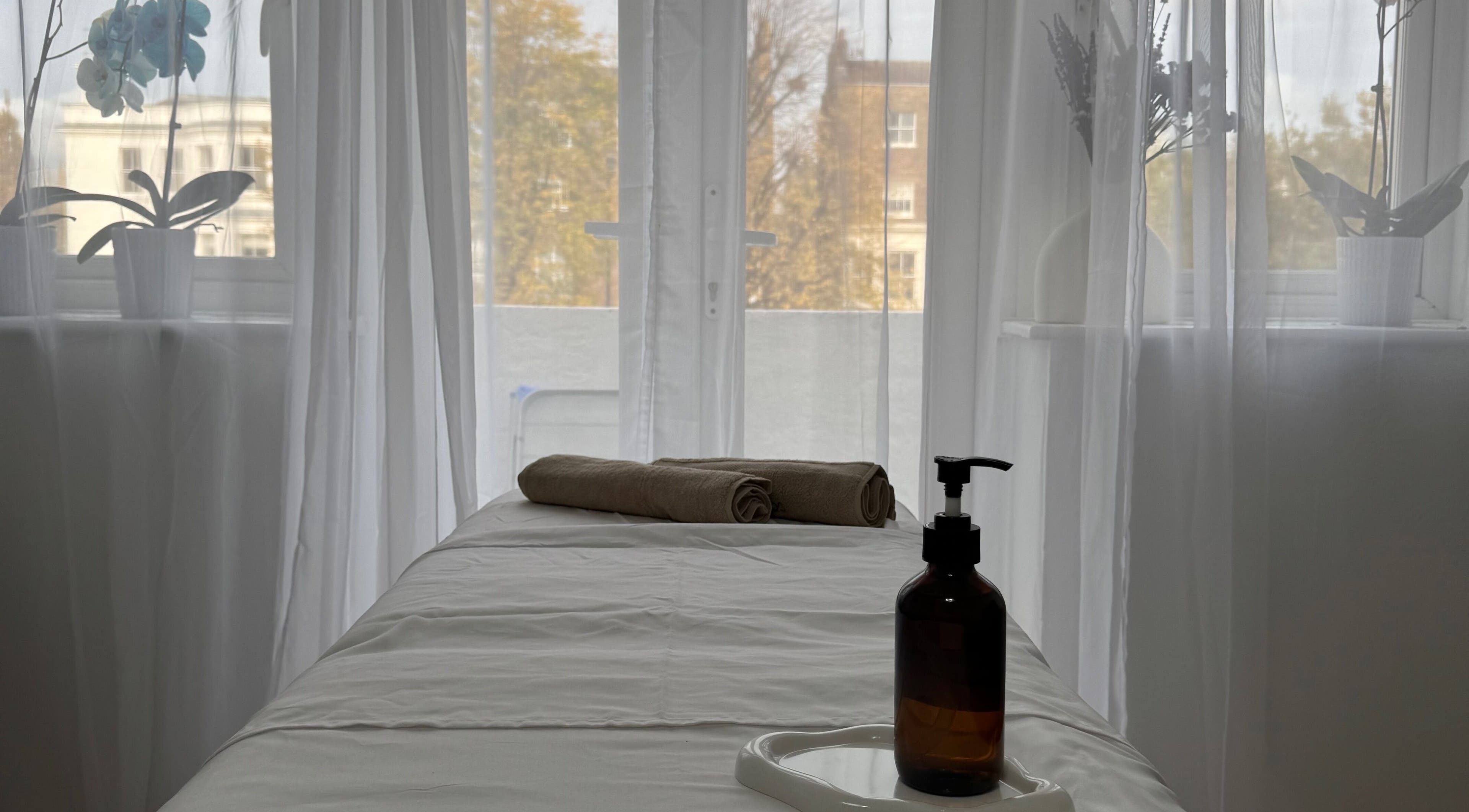 Massage table in tranquil spa setting at Contourista London - Mobile Services, London, England, GB.