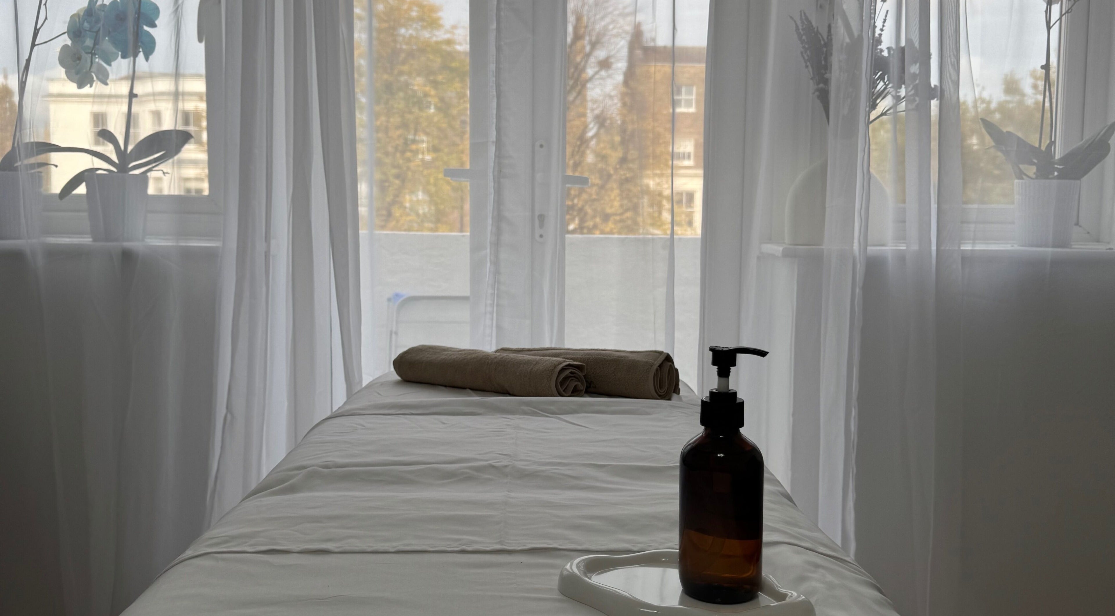 Massage table in tranquil spa setting at Contourista London - Mobile Services, London, England, GB.