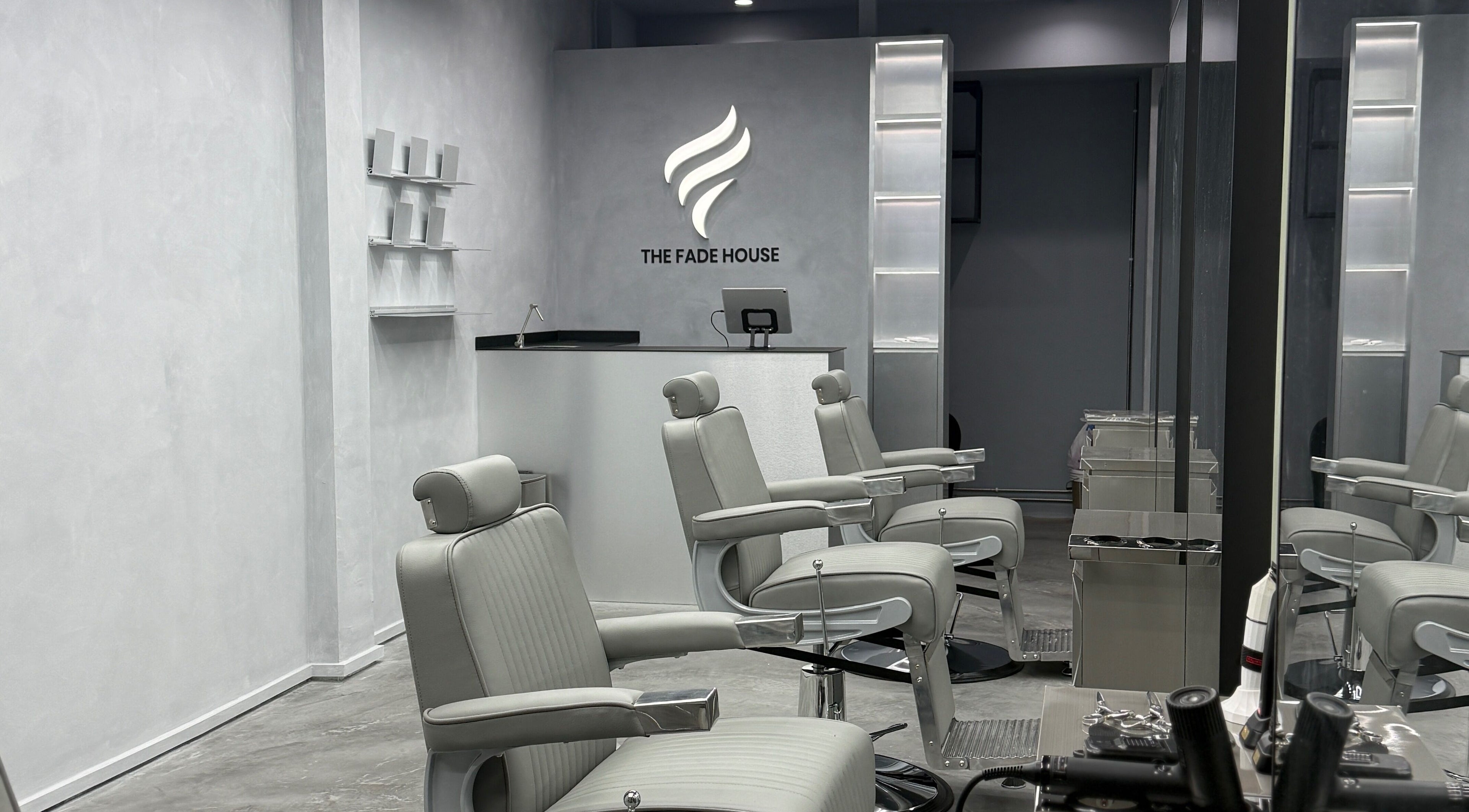 Modern barber chairs in The Fade House, Singapore, SG offering premium hair styling services.