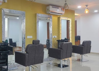 Chic interior of Jawed Habib Unisex Salon - Hopefarm Whitefield, Bengaluru, Karnataka, IN with stylish chairs and mirrors.