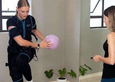 Personal training at Burn Studio, Gqeberha, Eastern Cape, ZA with a woman using EMS technology.