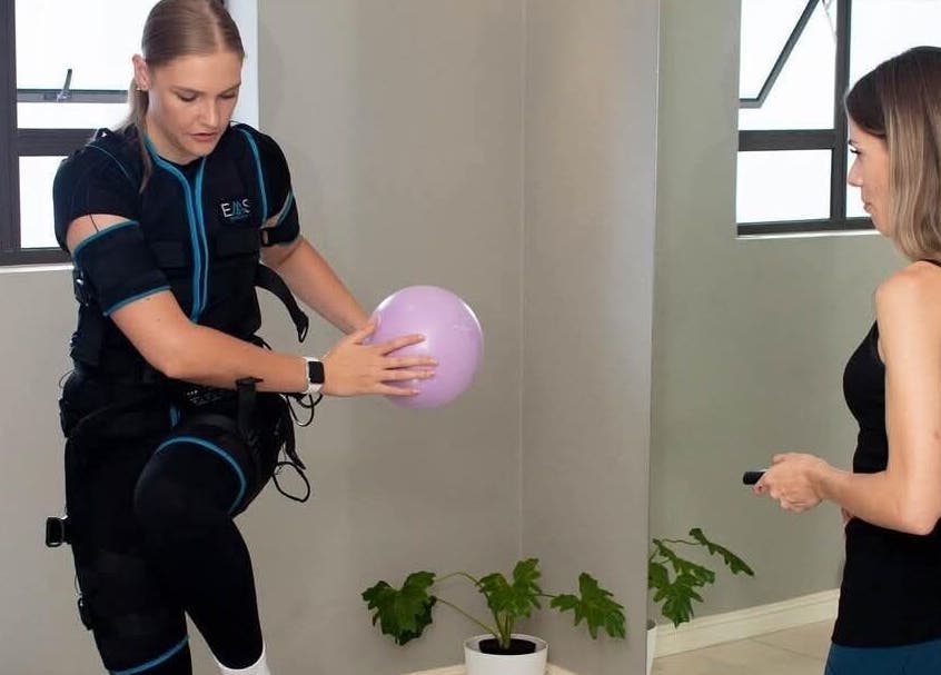 Personal training at Burn Studio, Gqeberha, Eastern Cape, ZA with a woman using EMS technology.