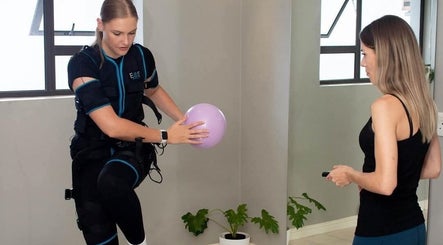 Personal training at Burn Studio, Gqeberha, Eastern Cape, ZA with a woman using EMS technology.