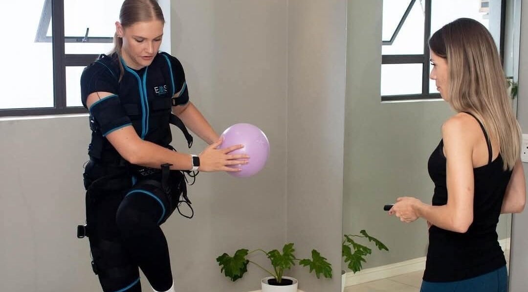 Personal training at Burn Studio, Gqeberha, Eastern Cape, ZA with a woman using EMS technology.