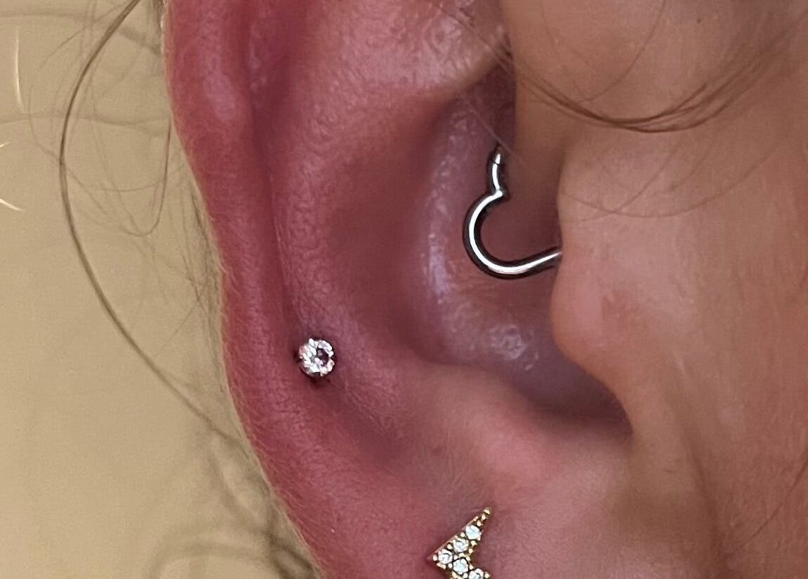Stylish ear piercing at KB Piercings & Pearly Whites, Garforth, England, GB, showcasing elegant jewelry.