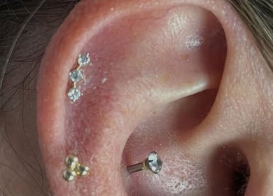 Elegant ear piercings with gemstones at KB Piercings & Pearly Whites in Garforth, England, GB.