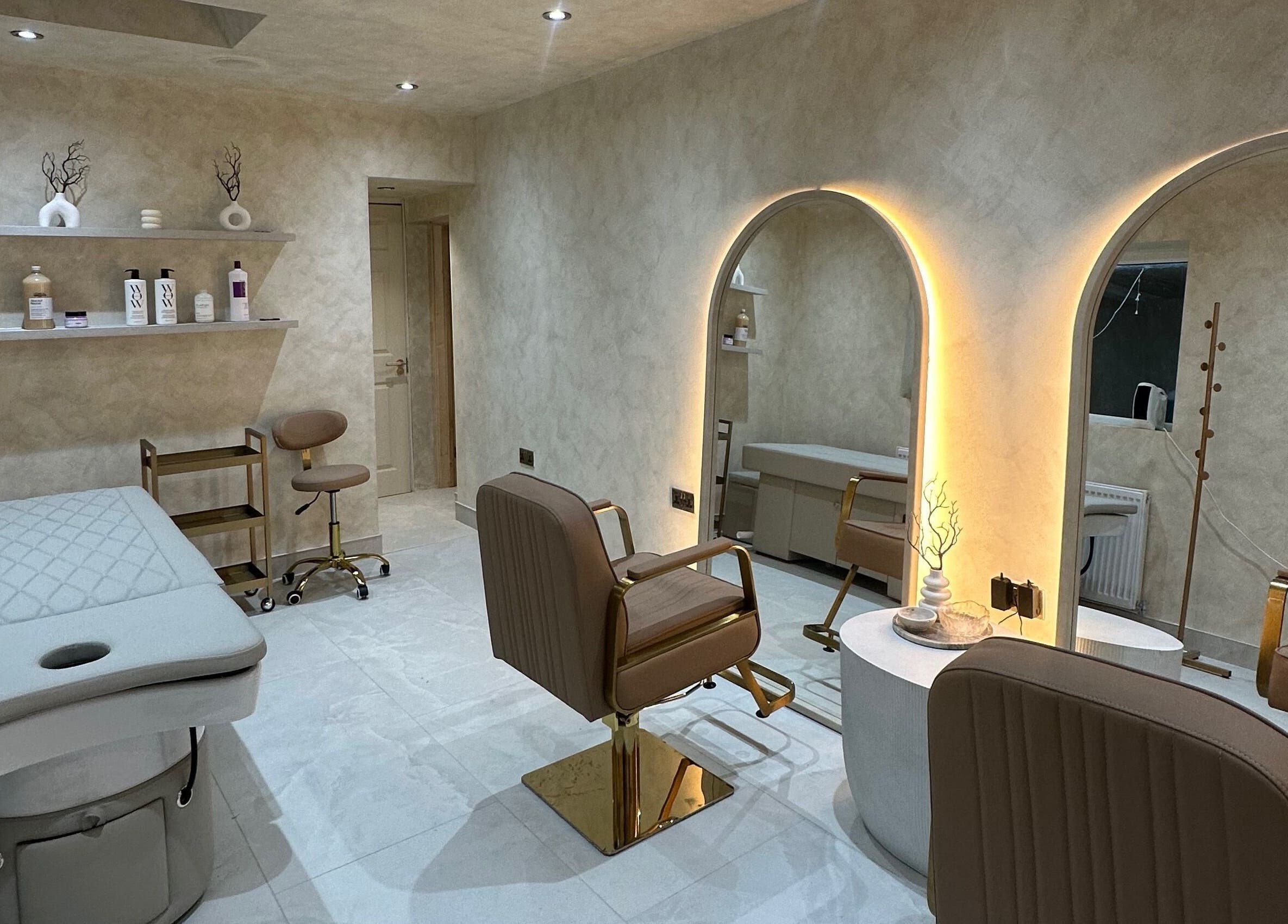 Chic interior of HBA HAIR, Leicester, England, GB showcases modern salon design with elegant chairs and mirrors.